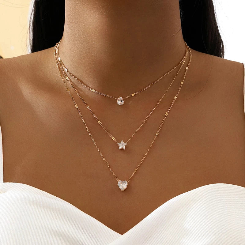 Collar de tres colgantes con circonita dorada