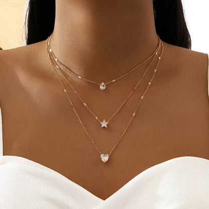 Collar de tres colgantes con circonita dorada