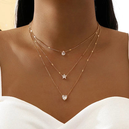 Collar de tres colgantes con circonita dorada
