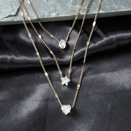 Collar de tres colgantes con circonita dorada