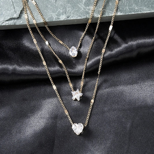 Collar de tres colgantes con circonita dorada