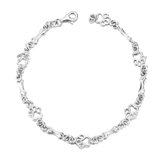 Pulsera con charms de huella y hueso en plata