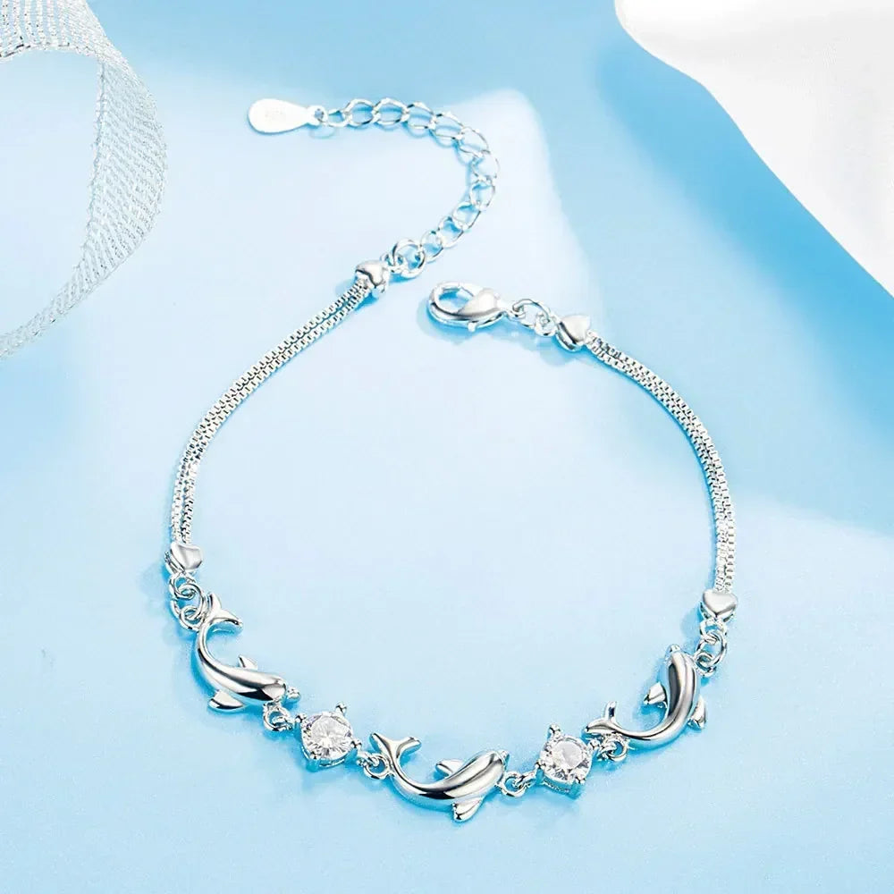 Conjunto de joyería de delfines en plata de ley